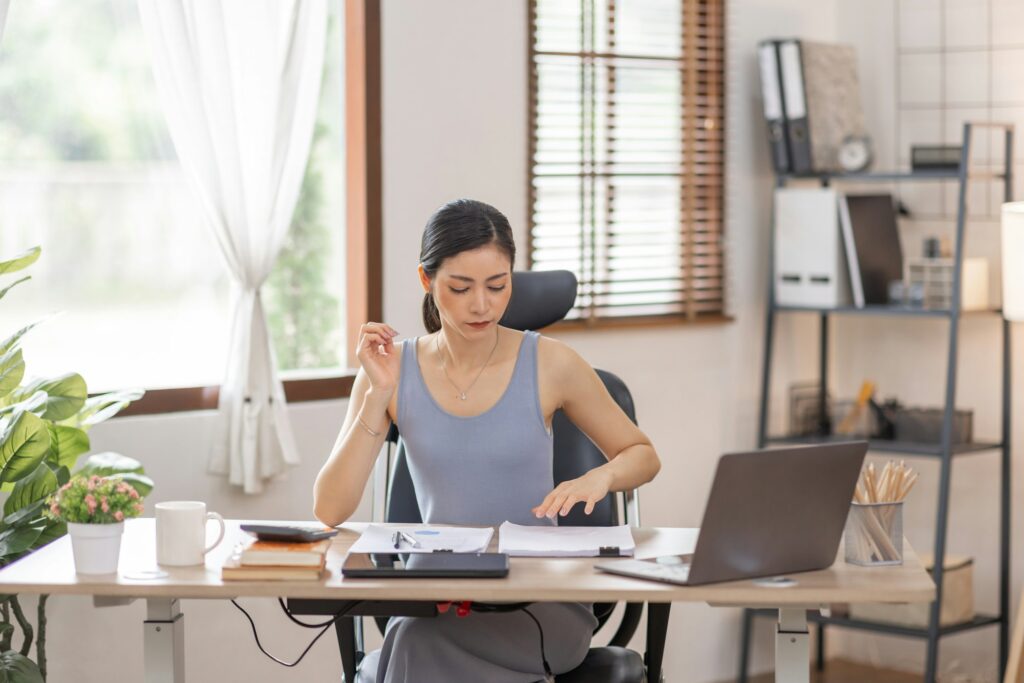 Portrait woman of smiling Happy Young Asian female freelancer working at home, Asian finance account