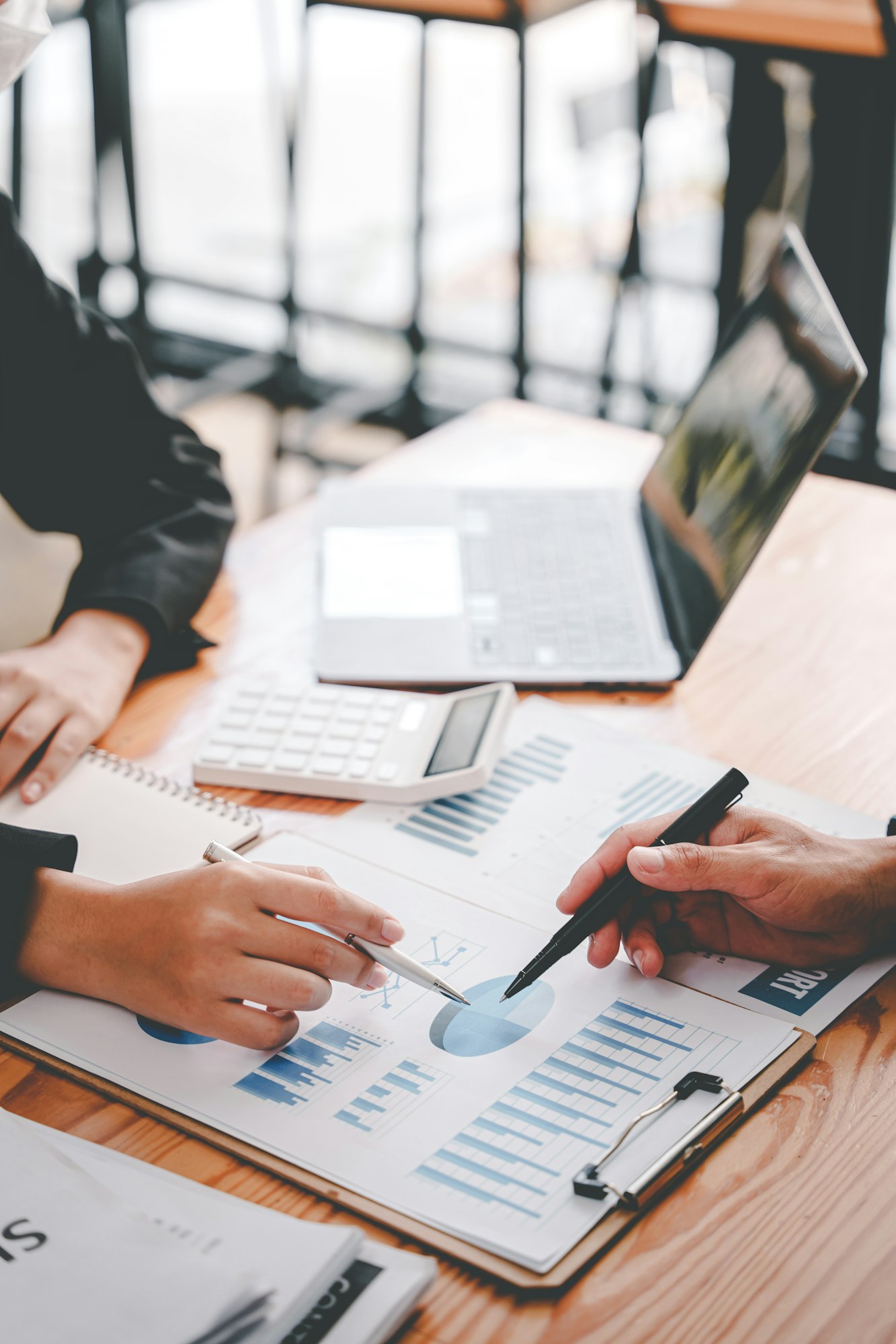 The financiers are calculating personal taxes for their customers.